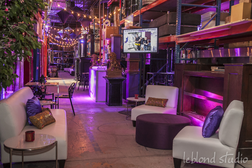 The warehouse was transformed into an upscale Streets of Toronto, one of Décor & More's signature installs, with each aisle representing a different district of the city. Chinatown was showcased with an abundance of purple lanterns strung overhead as well as other Asian inspired elements at food stations or tucked into lounges. 