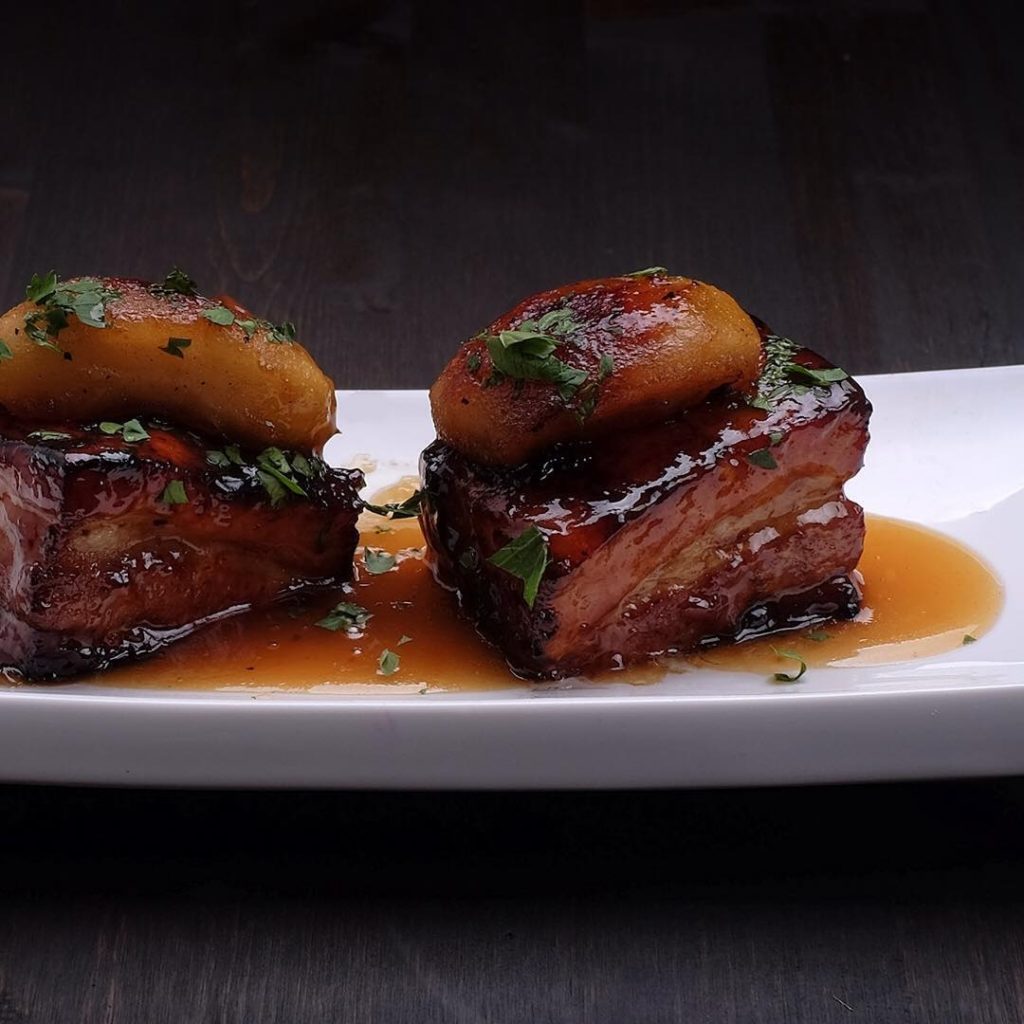 porkbelly with calvados glaze and roasted apple by Savoury City Catering