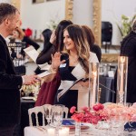 Student Monica Esposito pitches her event, entitled The Blossoming of Happiness, to industry judge Todd Kjargaard from Jackie O Flowers.