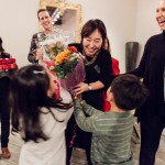 First-place winner Seonhye Kim is congratulated by family members and faculty.