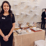 Second-place winner Brittney Gee poses with her For the Love of Books wedding tabletop.